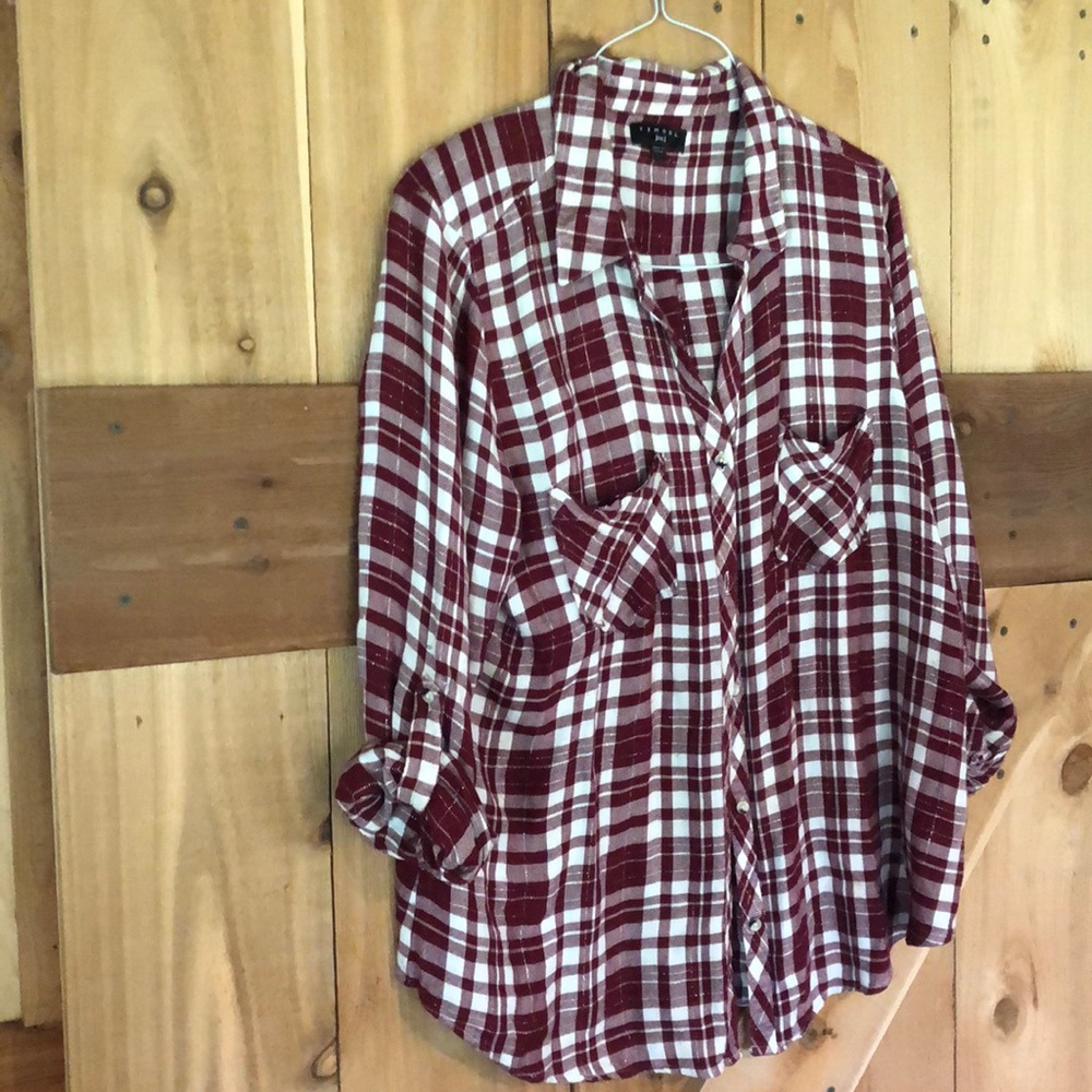 Light flannel shirt with silver thread running through.